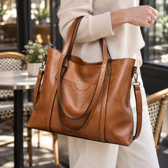 Close-up of the Eleonora tote carried on the forearm